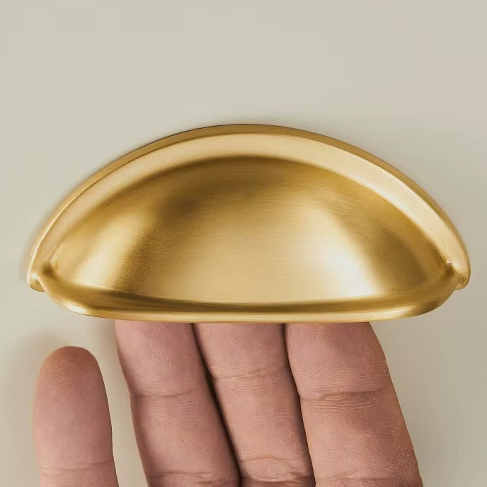 Smooth solid brass half-moon cup pull in brushed brass