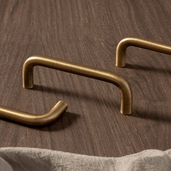 U-shaped solid brass wire cabinet pulls in antique brass