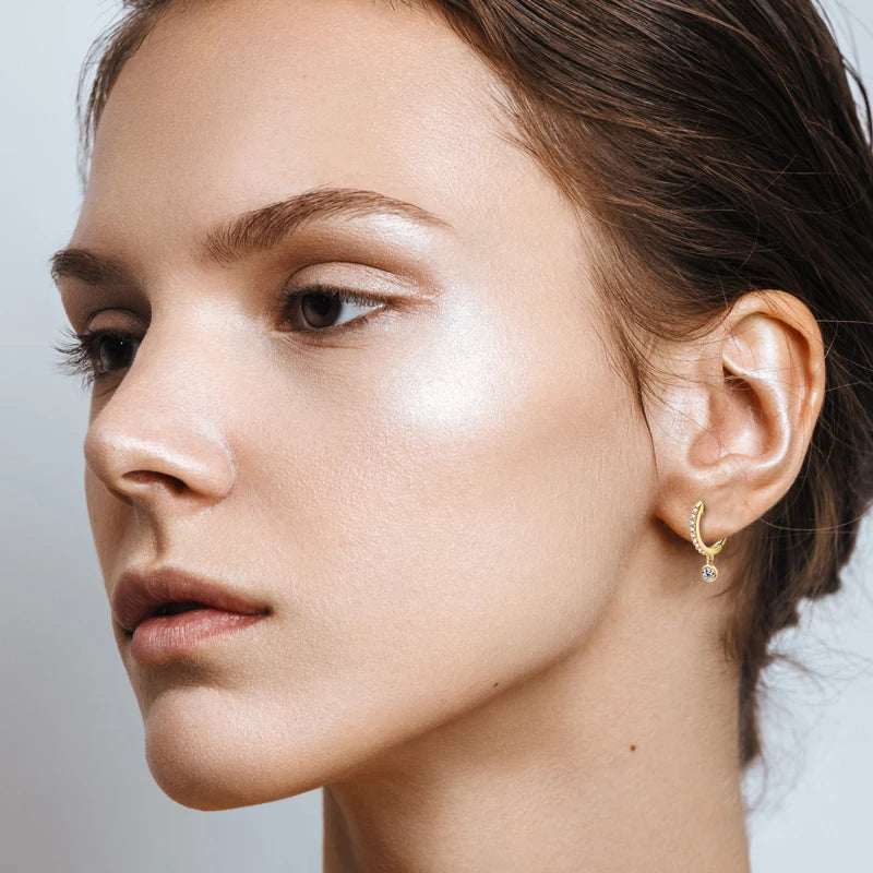 Bezel Drop Moissanite Huggie Earrings in Sterling Silver — Gold-Tone hoop worn on the ear