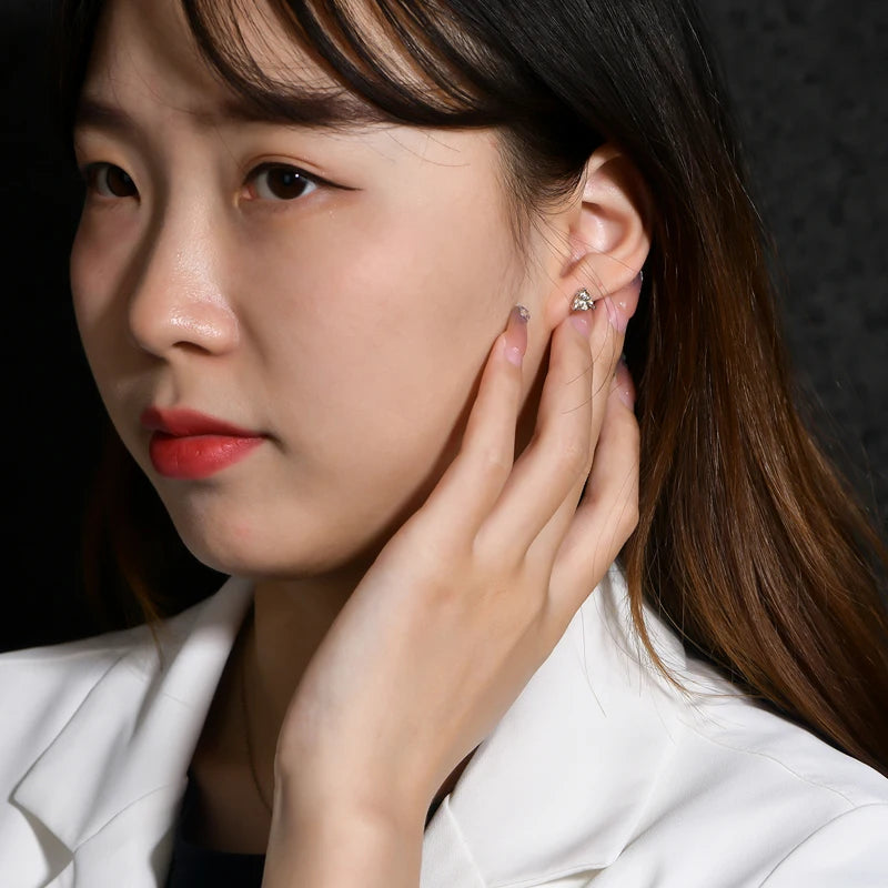Yellow Trillion Moissanite Stud Earrings in Sterling Silver — Trillion studs worn on the ear